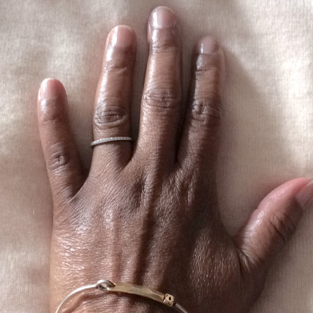 Nephora half eternity diamond band in white gold.